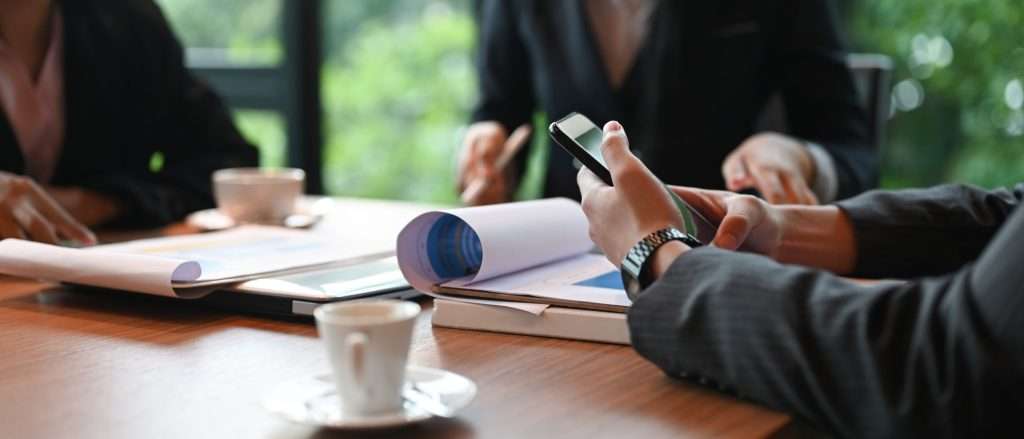 Cropped image of businesspeople is working together at the meeti